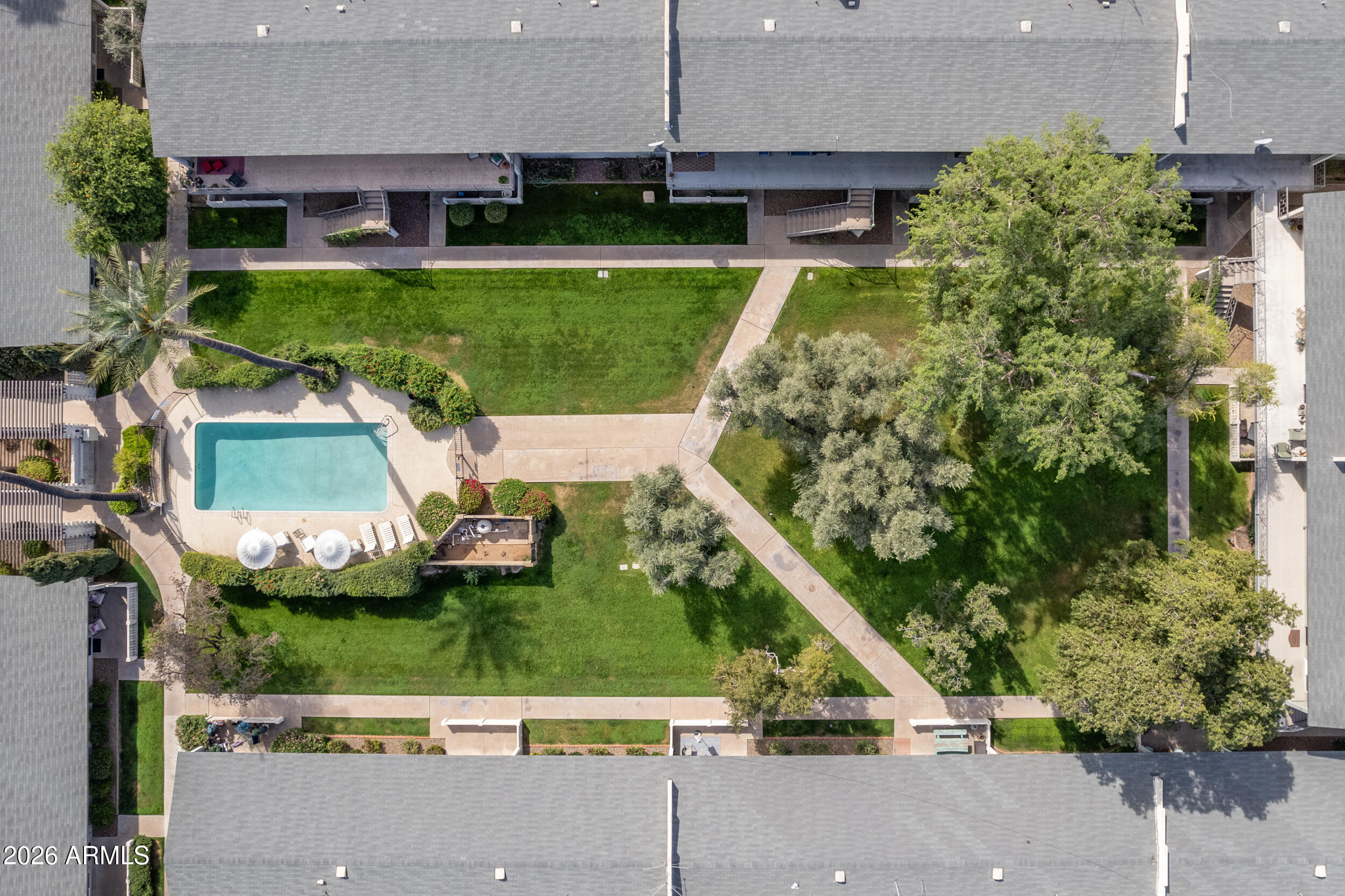 5550 North 12th Street, Unit 8 Phoenix, AZ 85014 - Photo 23 of 25 front view of a house with a yard