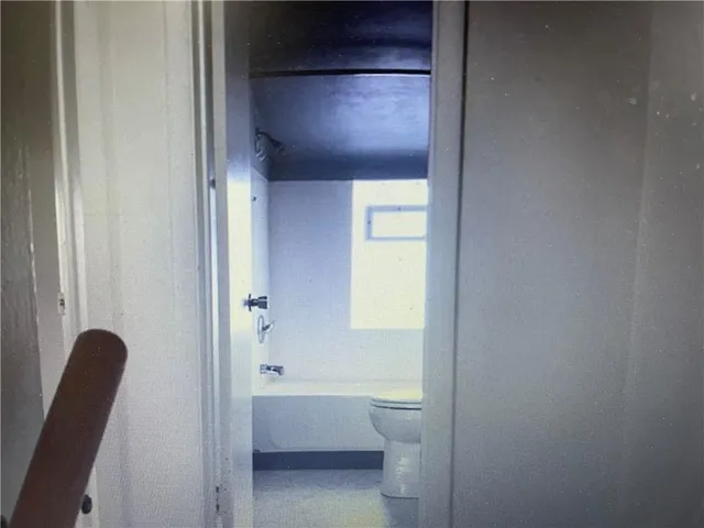 a bathroom with a sink toilet and bathtub