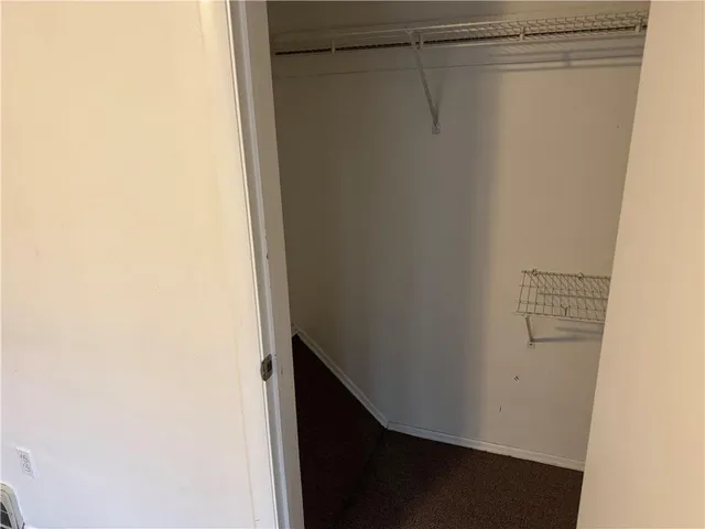 an empty room with a hallway