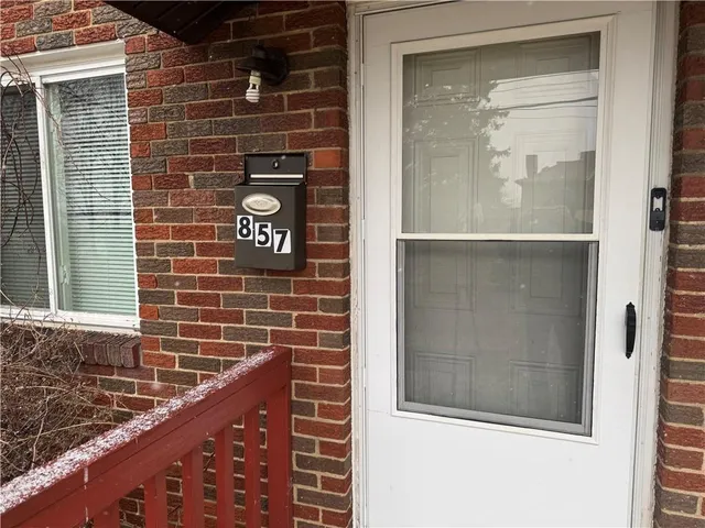 a view of a door and a street