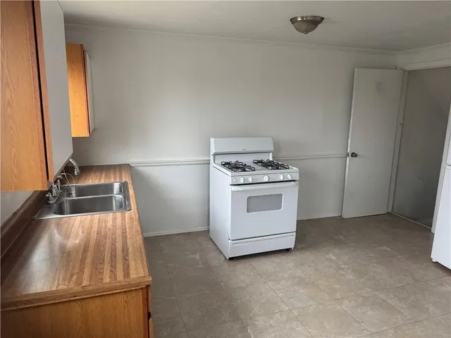 a kitchen with a stove and a sink