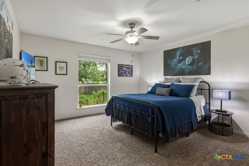3306 Spring Canyon Road Belton, TX 76513 - Photo 32 of 40 a spacious bedroom with a bed and a window
