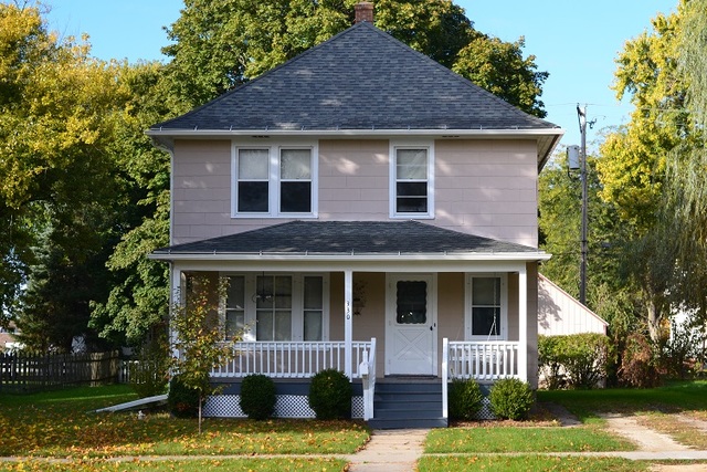 330 Woolf Court Rochelle, IL 61068 - Photo 1 of 15 a front view of a house with a garden