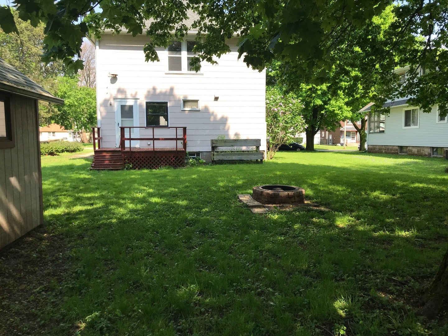330 Woolf Court Rochelle, IL 61068 - Photo 13 of 15 a view of backyard with house and garden