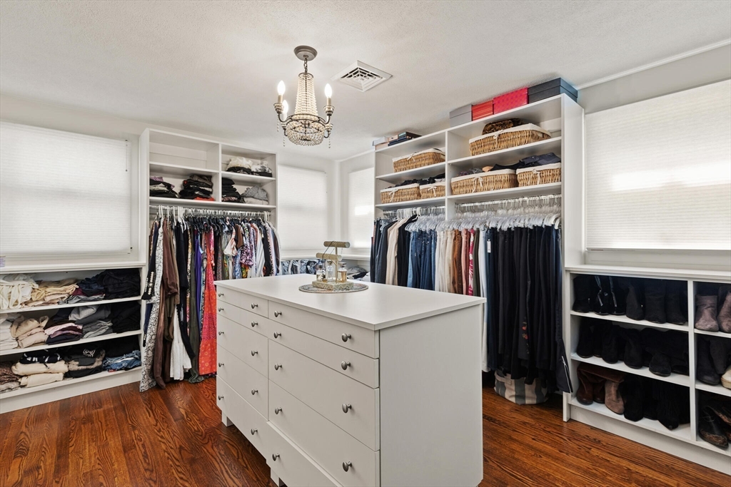 60 Amherst Road Newton, MA 02468 - Photo 13 of 25 a view of walk in closet with clothes and shoes