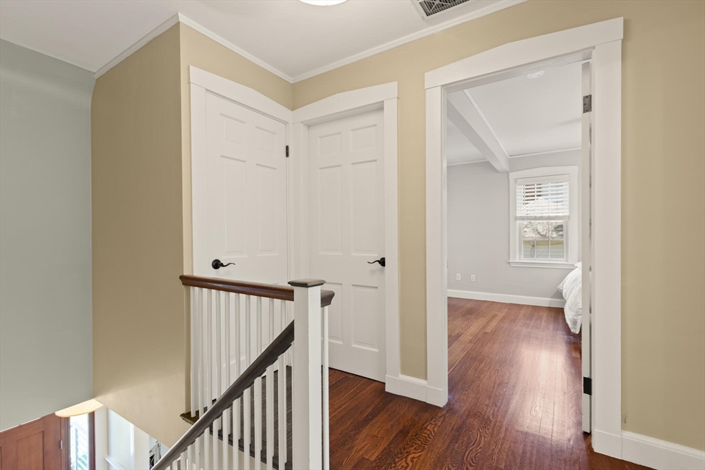 60 Amherst Road Newton, MA 02468 - Photo 17 of 25 a view of a hallway with wooden floor and entryway