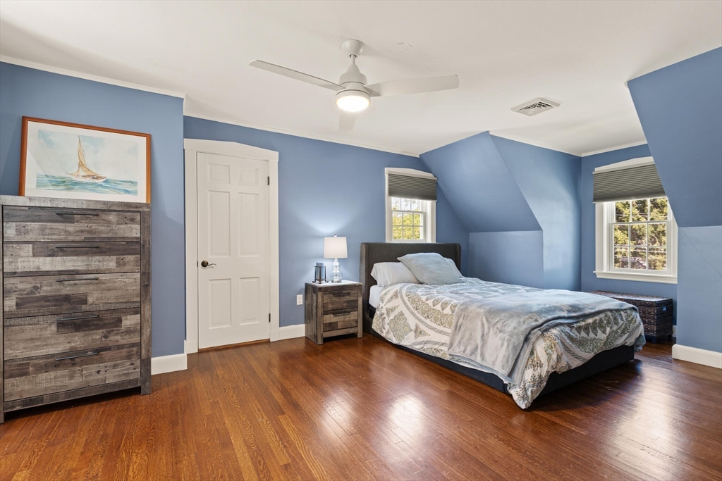 60 Amherst Road Newton, MA 02468 - Photo 18 of 25 a bedroom with a bed and wooden floor