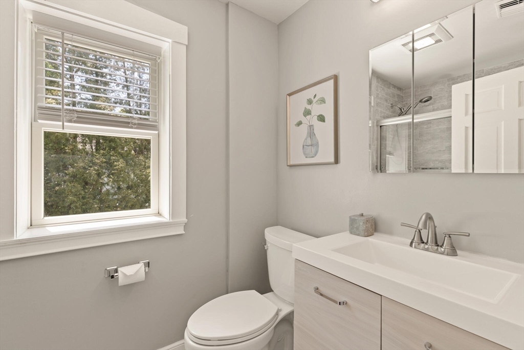 60 Amherst Road Newton, MA 02468 - Photo 20 of 25 a bathroom with a sink a toilet and a window