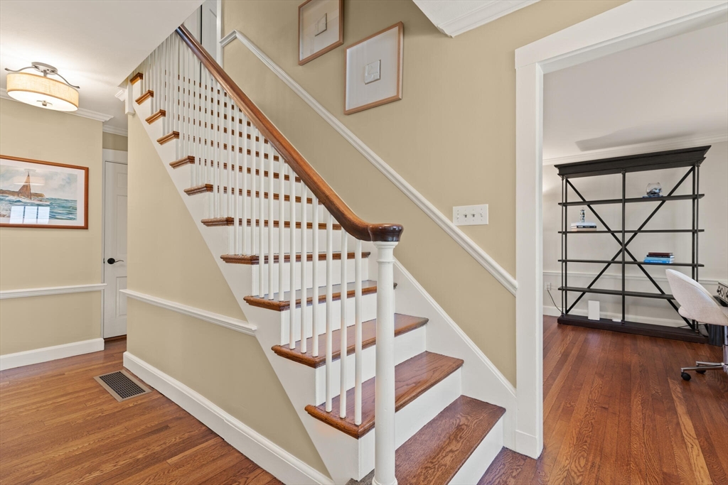 60 Amherst Road Newton, MA 02468 - Photo 2 of 25 a view of entryway with wooden floor and stairs