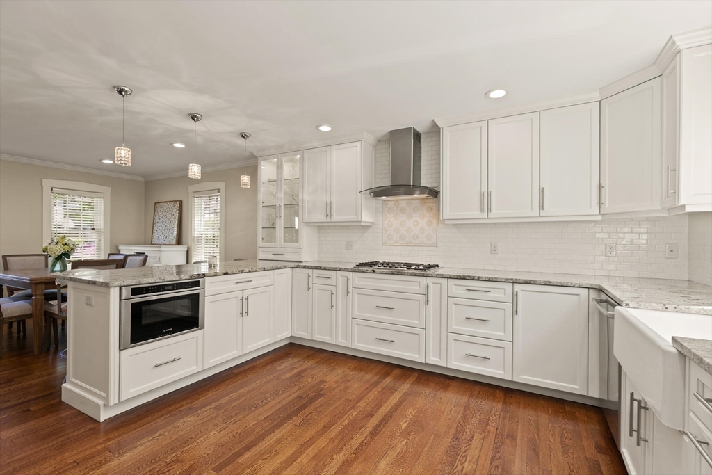 60 Amherst Road Newton, MA 02468 - Photo 5 of 25 a kitchen with a white cabinets and white appliances