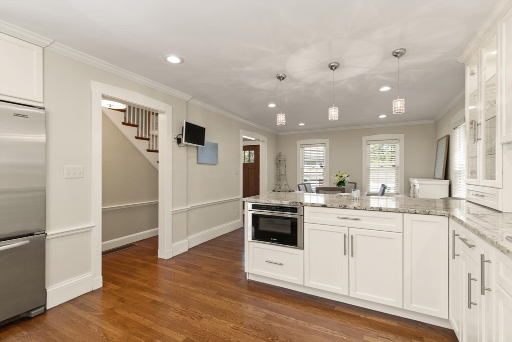 60 Amherst Road Newton, MA 02468 - Photo 6 of 25 a kitchen with a sink and wooden floor