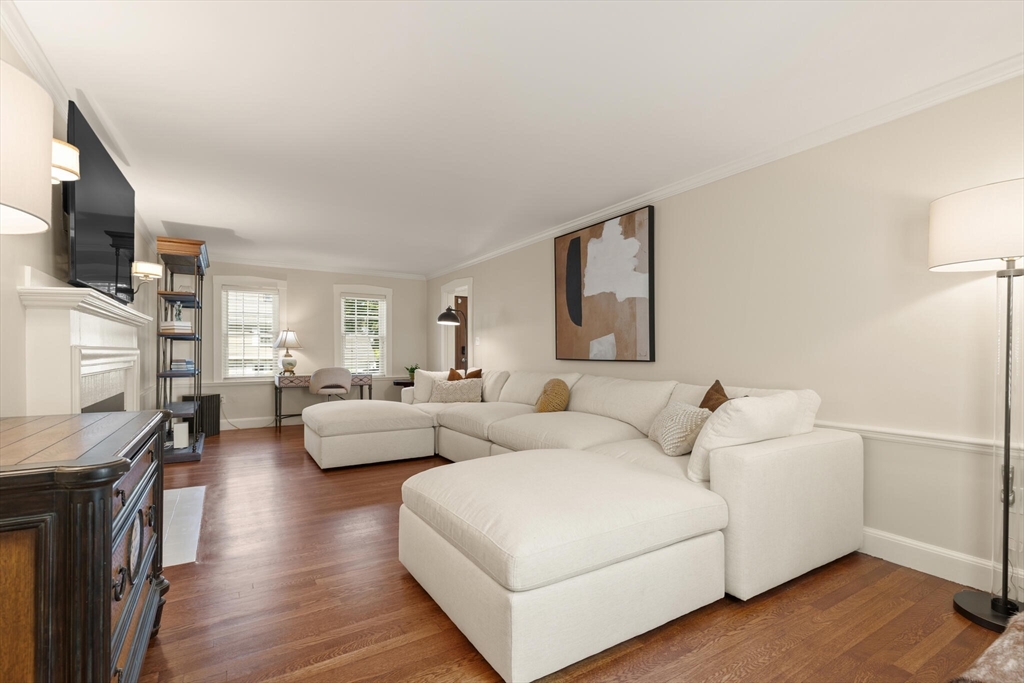 60 Amherst Road Newton, MA 02468 - Photo 10 of 25 a living room with furniture flat screen tv and a fireplace