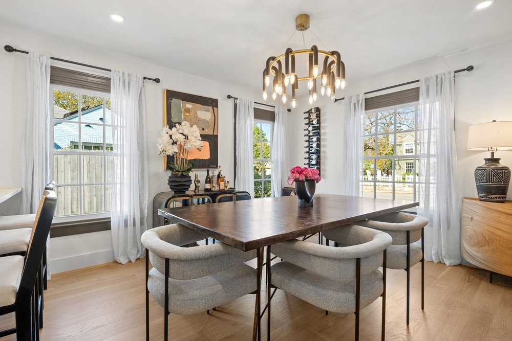 1519 West 29th Street Austin, TX 78703 - Photo 17 of 37 a dining room with furniture a chandelier and wooden floor