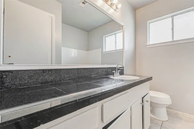 a close view of sink and mirror