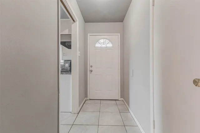 a kitchen with stainless steel appliances granite countertop a stove a sink and a white cabinets