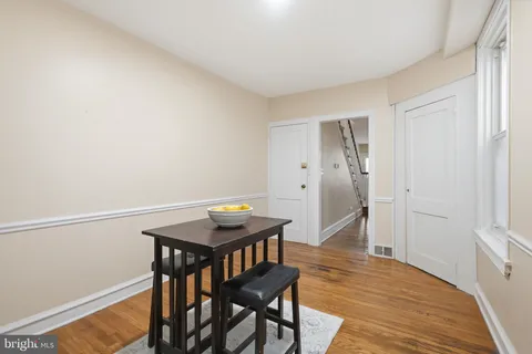 a view of a room with furniture and wooden floor
