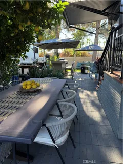 a swimming pool with outdoor seating