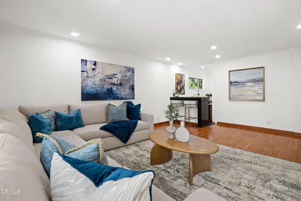 a view of a dining room with furniture and chandelier