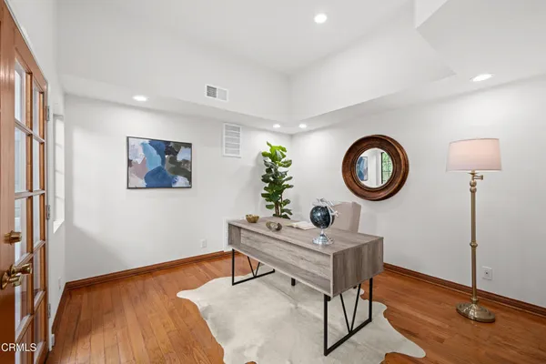 a view of an entryway with wooden floor