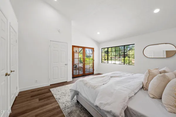 a bedroom with a bed and a chair