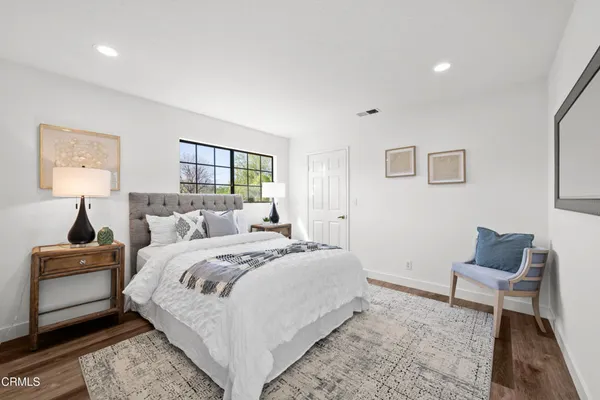 a view of a brick house with large windows