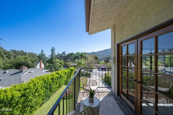a view of a pathway with a flower garden