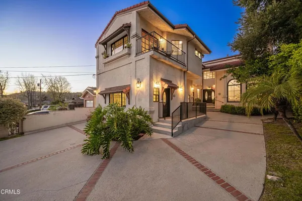 an aerial view of a house with mountain view