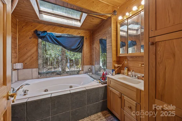 a view of a house with a yard and garage