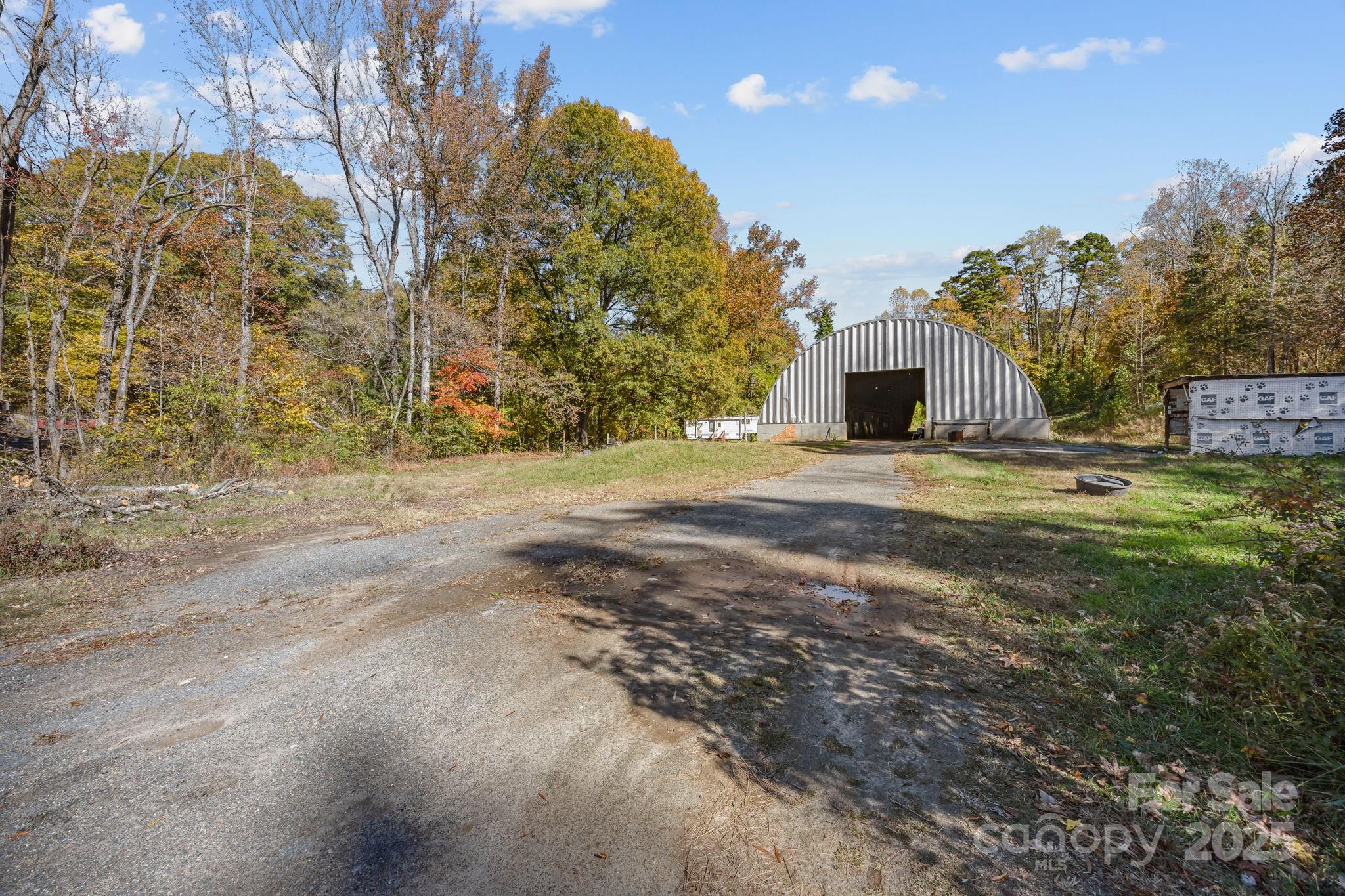 3178 Foxford Road Concord, NC 28025 - Photo 16 of 48 a view of a house with a yard and garage