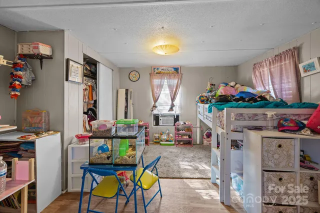 a view of a field with trees in the background