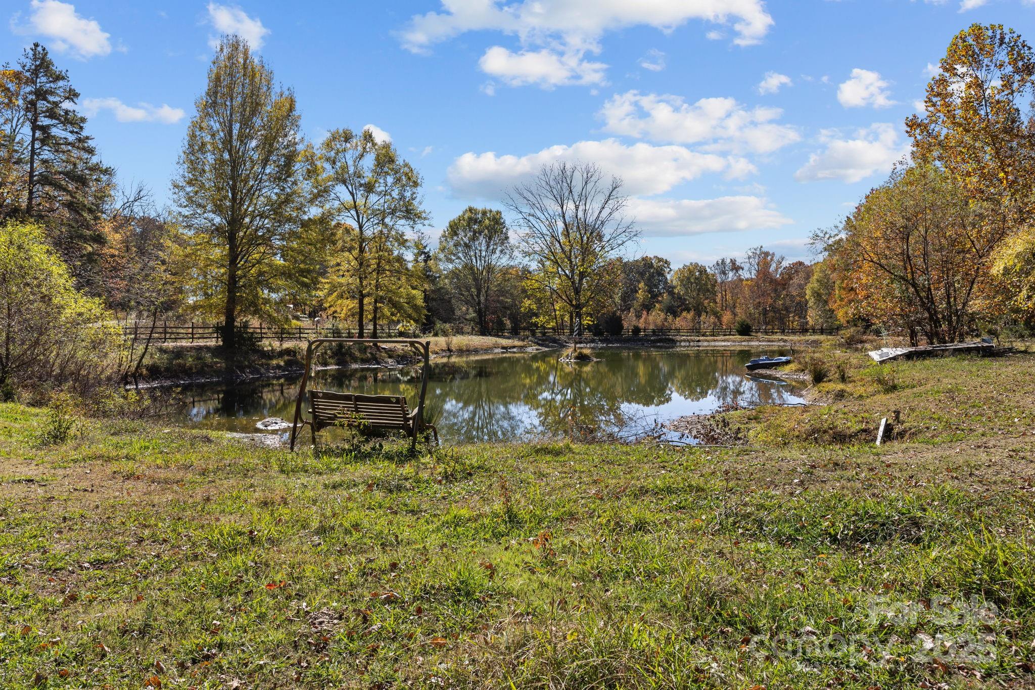 3178 Foxford Road Concord, NC 28025 - Photo 38 of 48 a view of a lake with houses