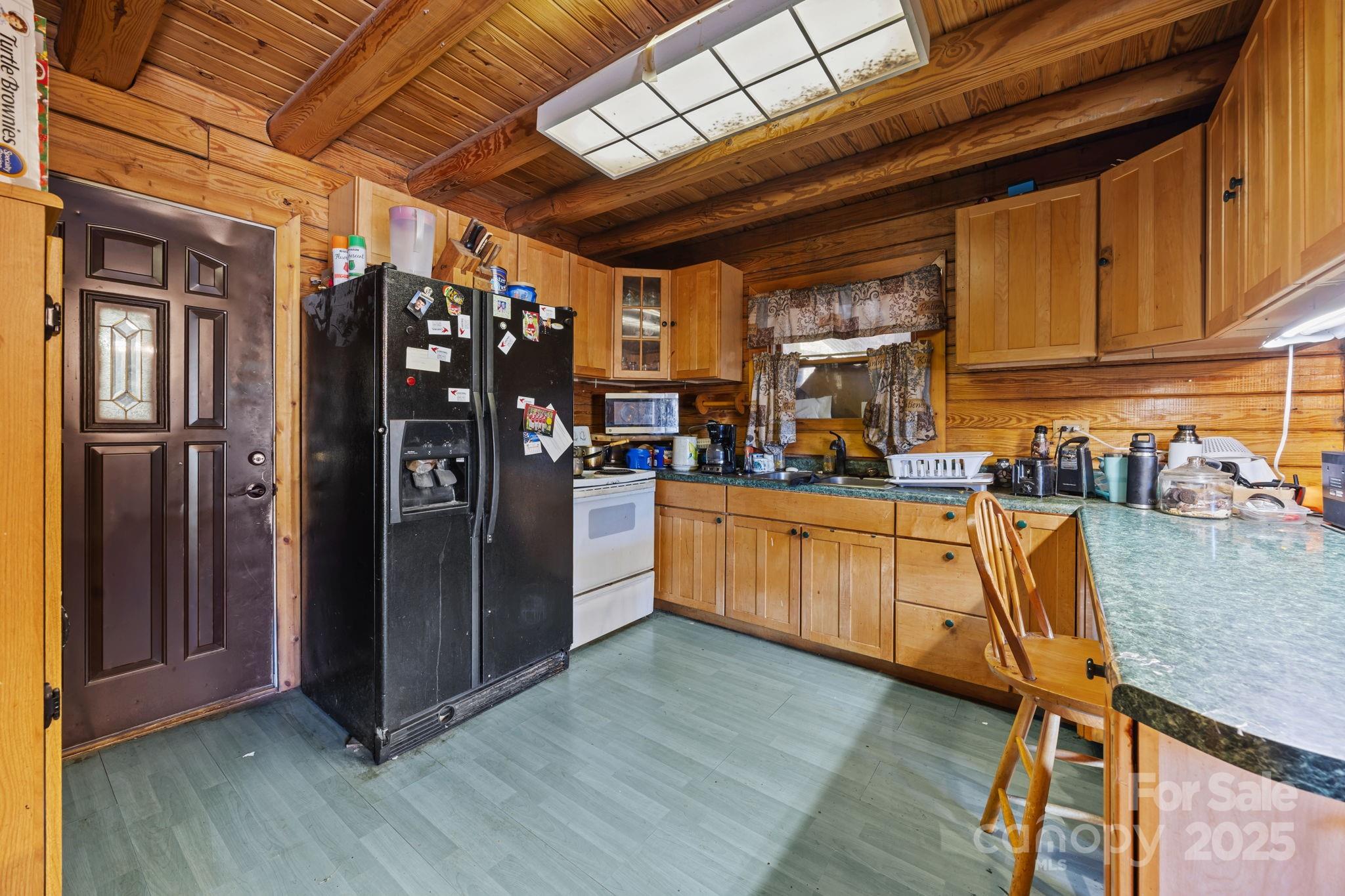 3178 Foxford Road Concord, NC 28025 - Photo 8 of 48 a kitchen with stainless steel appliances granite countertop a refrigerator and wooden cabinets