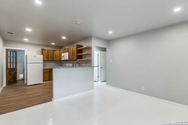a view of a kitchen with a sink