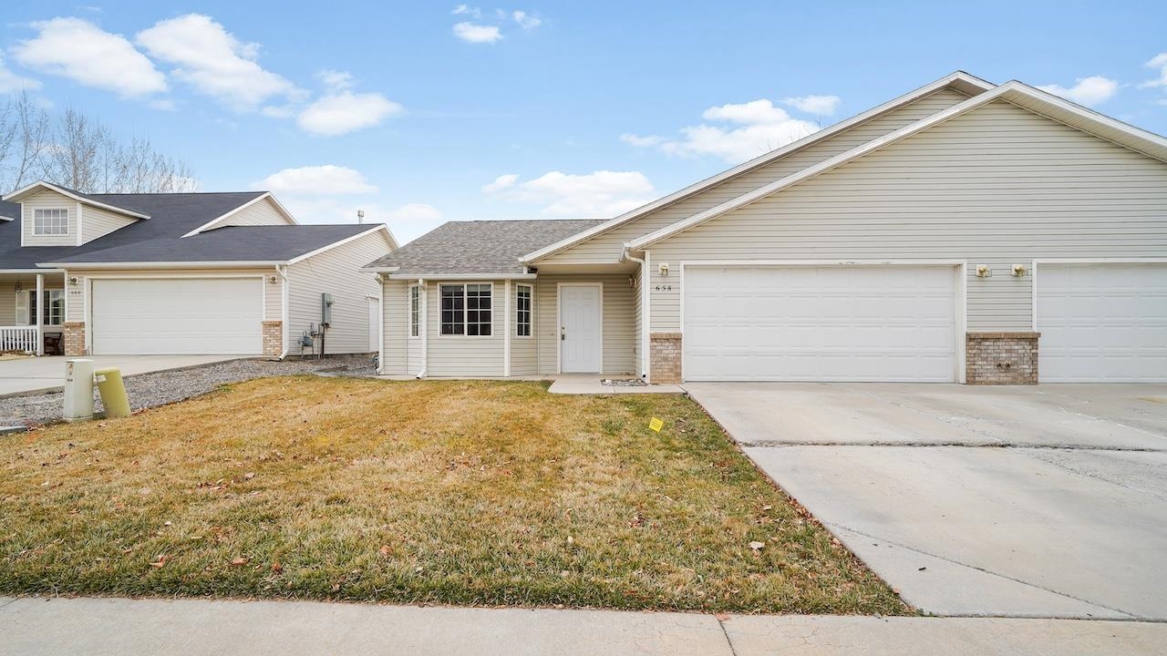 a view of house with yard