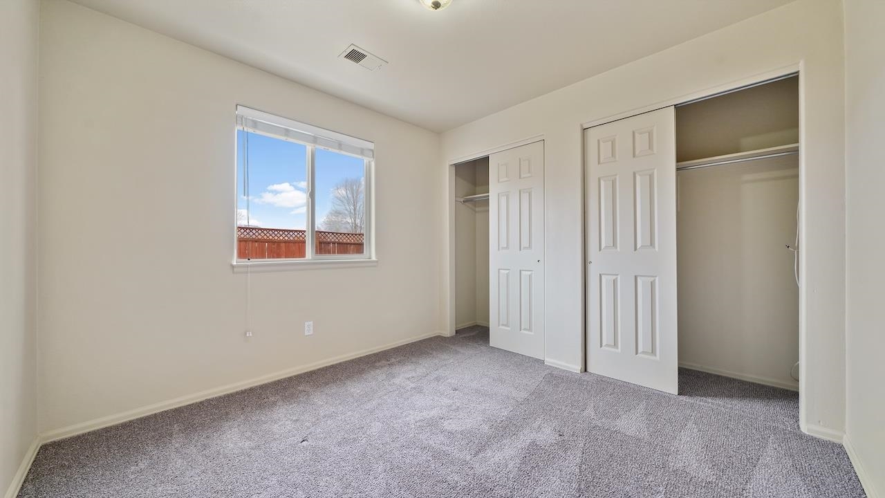658 Springbrook Drive Grand Junction, CO 81504 - Photo 12 of 27 a view of an empty room with closet and a window