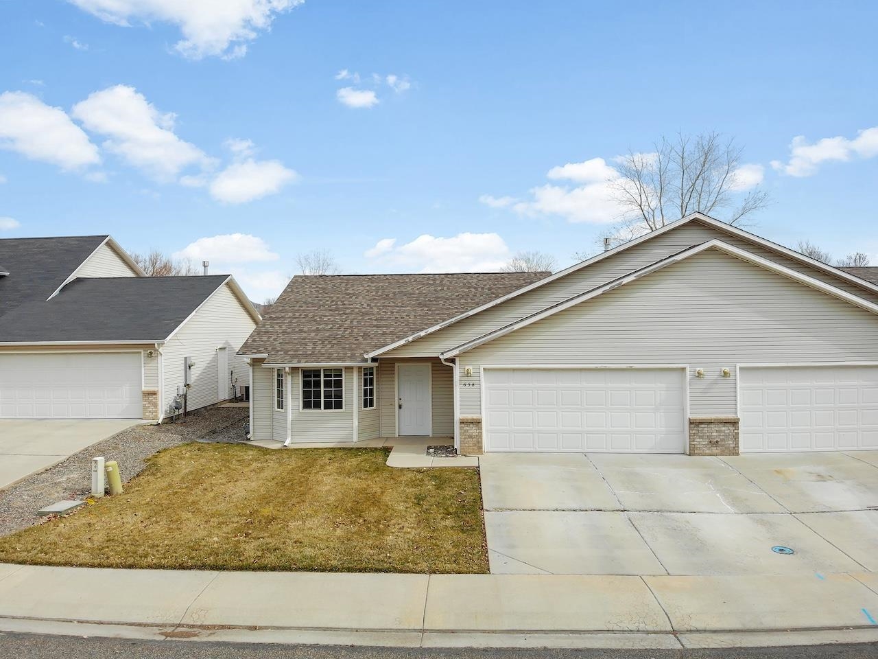 658 Springbrook Drive Grand Junction, CO 81504 - Photo 27 of 27 a view of a white house next to a yard
