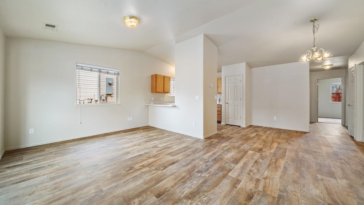 658 Springbrook Drive Grand Junction, CO 81504 - Photo 6 of 27 a view of empty room with wooden floor and fan