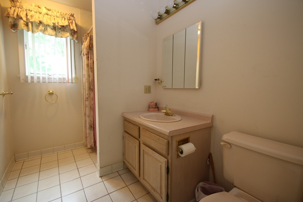 1 Lamplighters Way Saugus, MA 01906 - Photo 17 of 19 a bathroom with a sink toilet and mirror