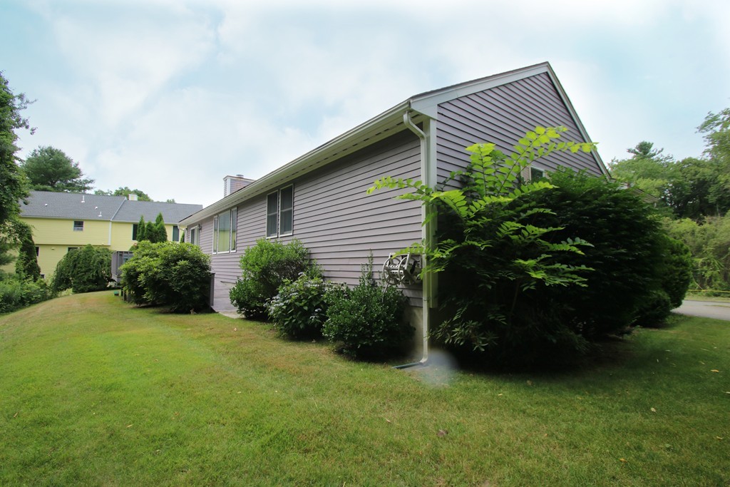 1 Lamplighters Way Saugus, MA 01906 - Photo 19 of 19 a backyard of a house with lots of green space