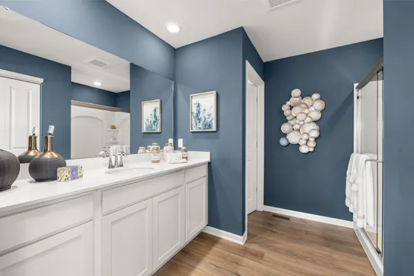 a bathroom with a double vanity sink and mirror