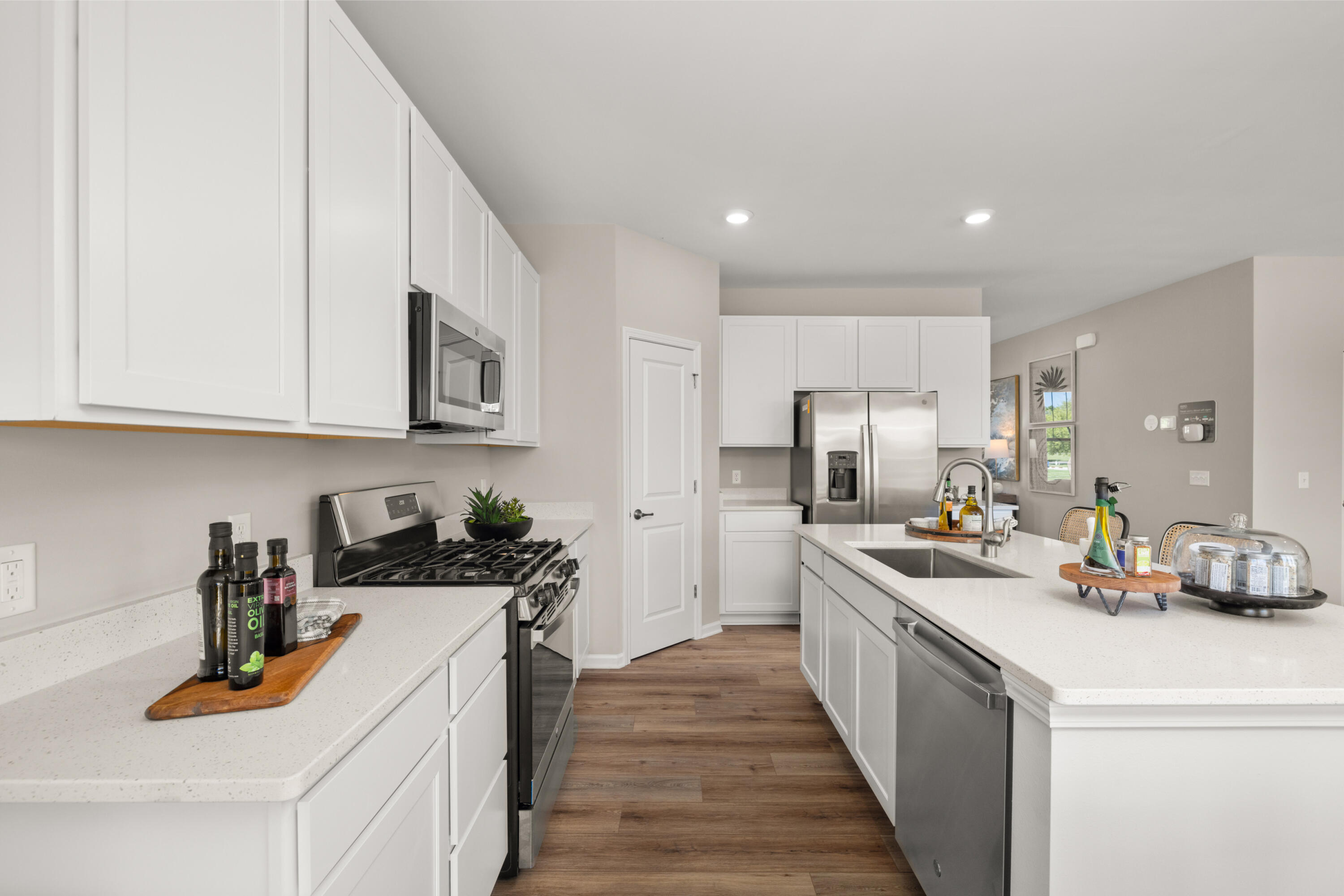 5567 Buttercup Avenue Portage, IN 46368 - Photo 5 of 17 a kitchen with stainless steel appliances granite countertop a sink stove and cabinets