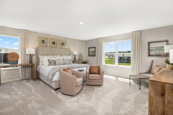 a spacious bedroom with a bed and glass window