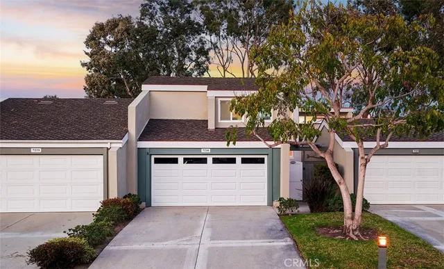 a living room with furniture a rug a fireplace and a wall painting