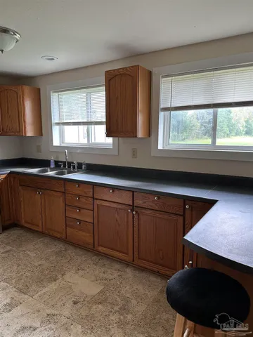 a kitchen with a sink and a window