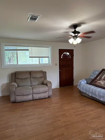 a living room with furniture and a window