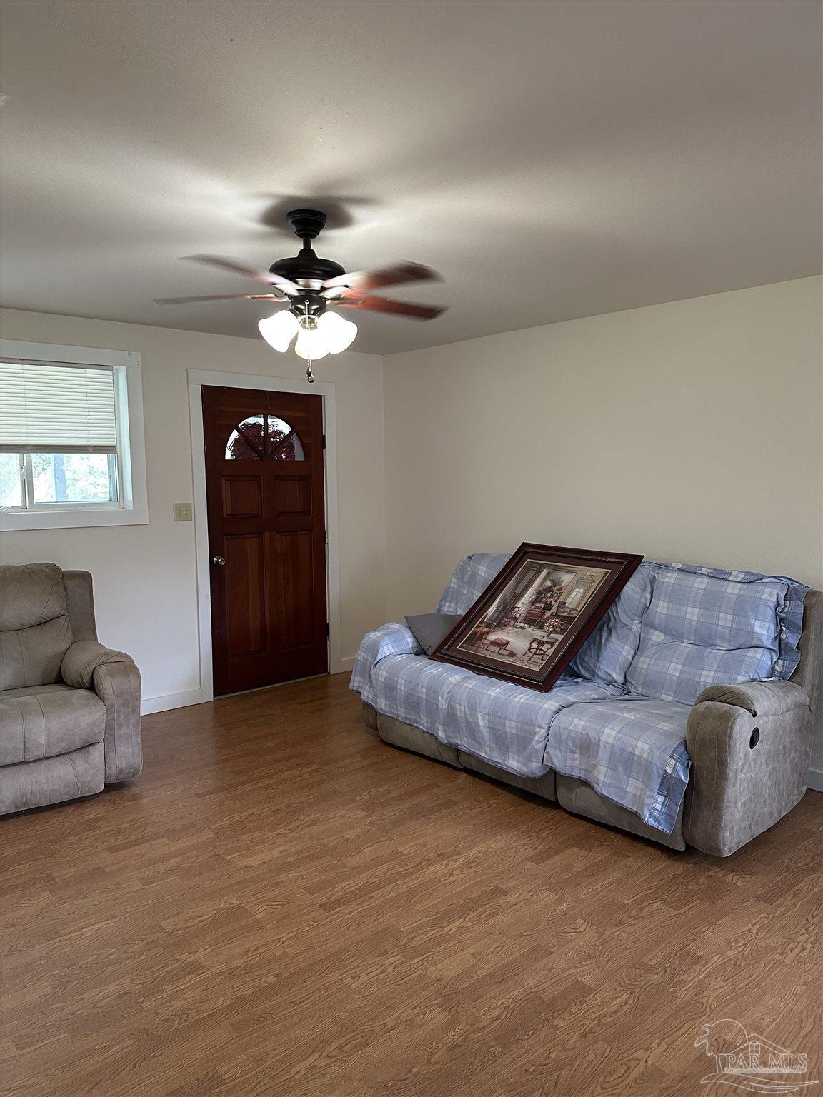 1052 Well Line Road Cantonment, FL 32533 - Photo 3 of 18 a living room with furniture and a ceiling fan