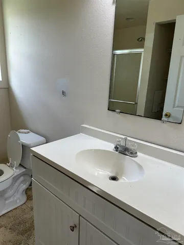 a bathroom with a sink and a toilet