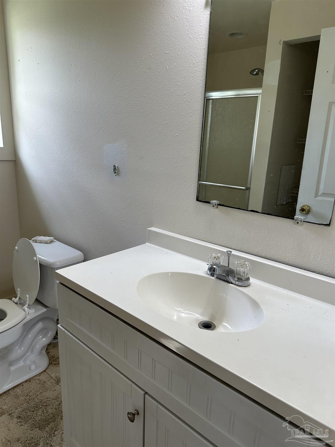 1052 Well Line Road Cantonment, FL 32533 - Photo 6 of 18 a bathroom with a sink and a toilet
