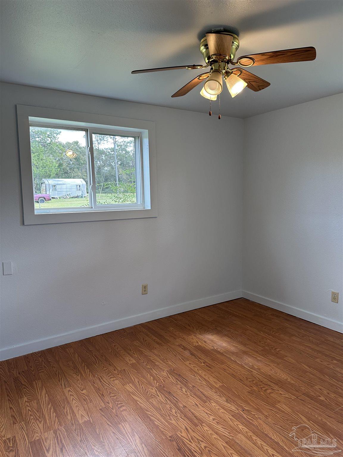 1052 Well Line Road Cantonment, FL 32533 - Photo 10 of 18 an empty room with a window