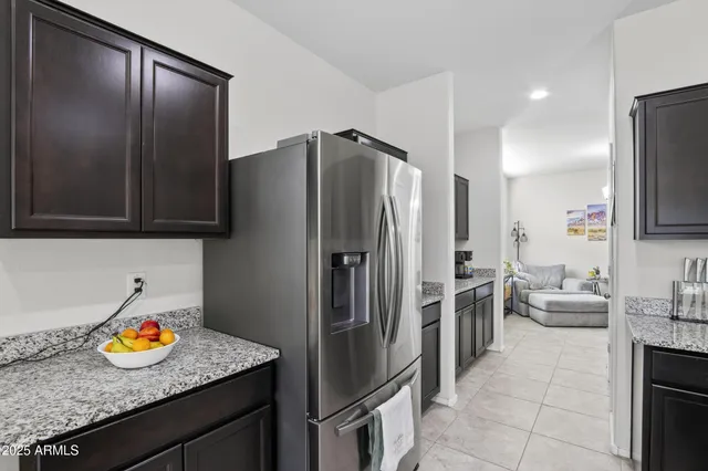 a kitchen with stainless steel appliances granite countertop a sink and a microwave